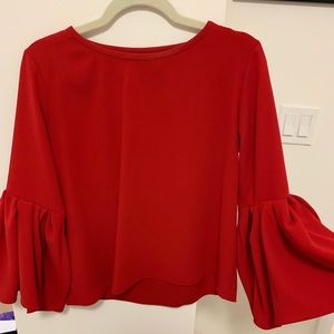 Red top with long bell sleeves